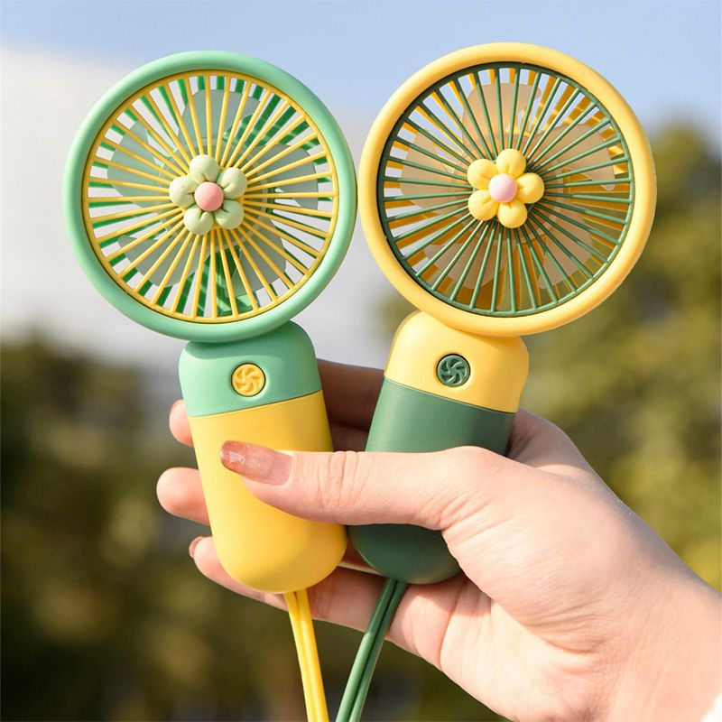 Mini desk fan with round grille head and handle, front view