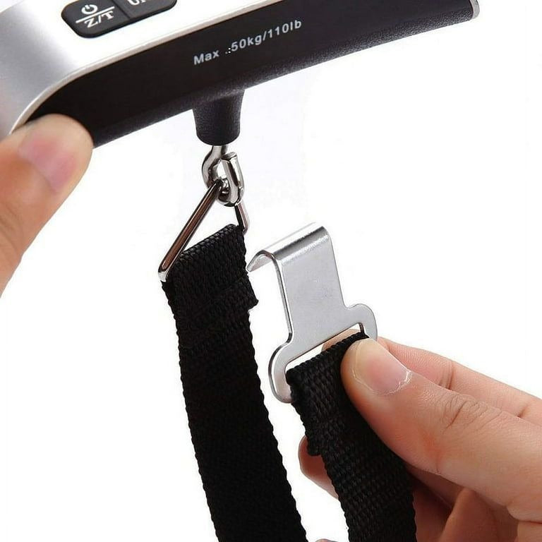 Digital luggage scale showing green-backlit LCD weight reading