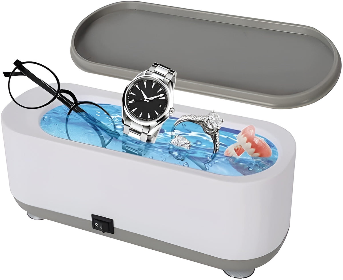 Ultrasonic jewelry cleaner white oval tank with lid on table