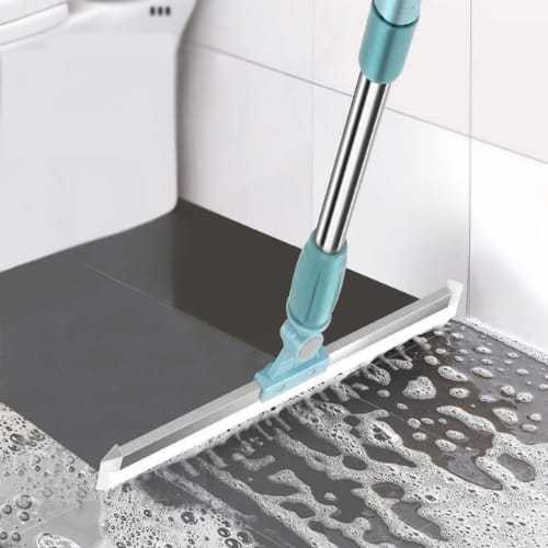 Magic broom pushing water across a tiled floor — squeegee edge clears liquid in one stroke