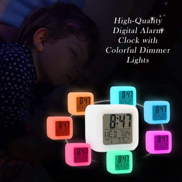 Glowing cube alarm clock showing time and temperature in changing LED colours