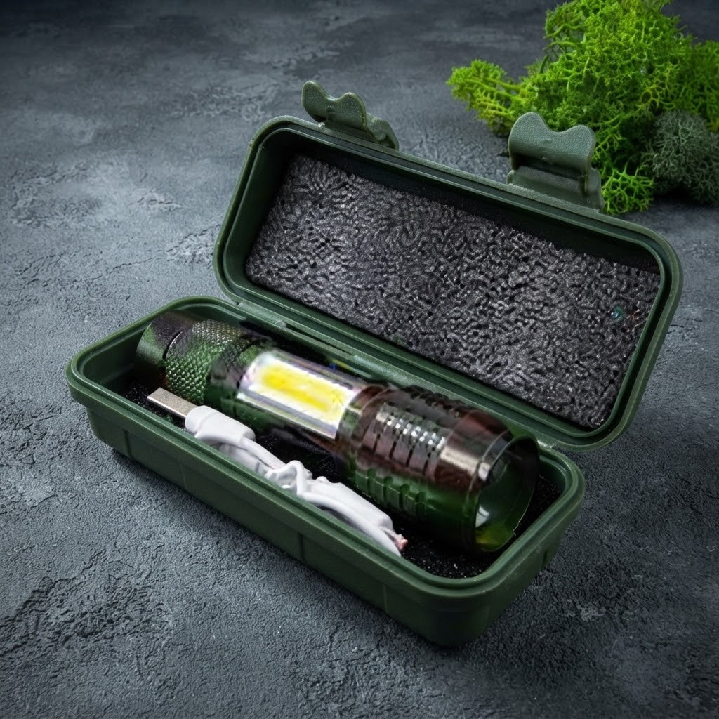 Rechargeable zoomable flashlight with side COB panel inside green protective case with USB cable