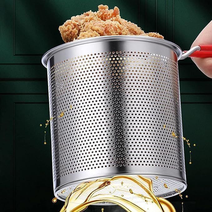 Crispy fried chicken lifted in the fryer basket — oil draining through the perforated mesh