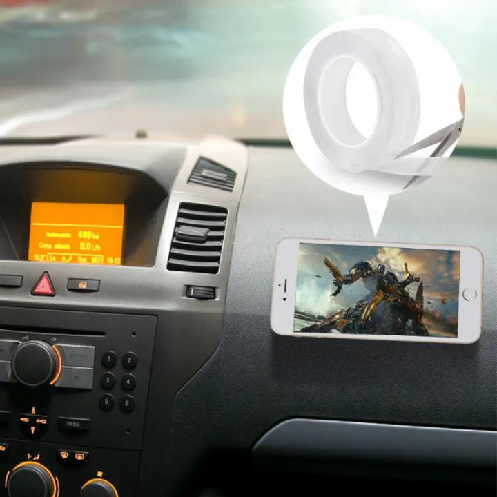 Nano double-sided tape in use — smartphone mounted on a car dashboard with the transparent tape