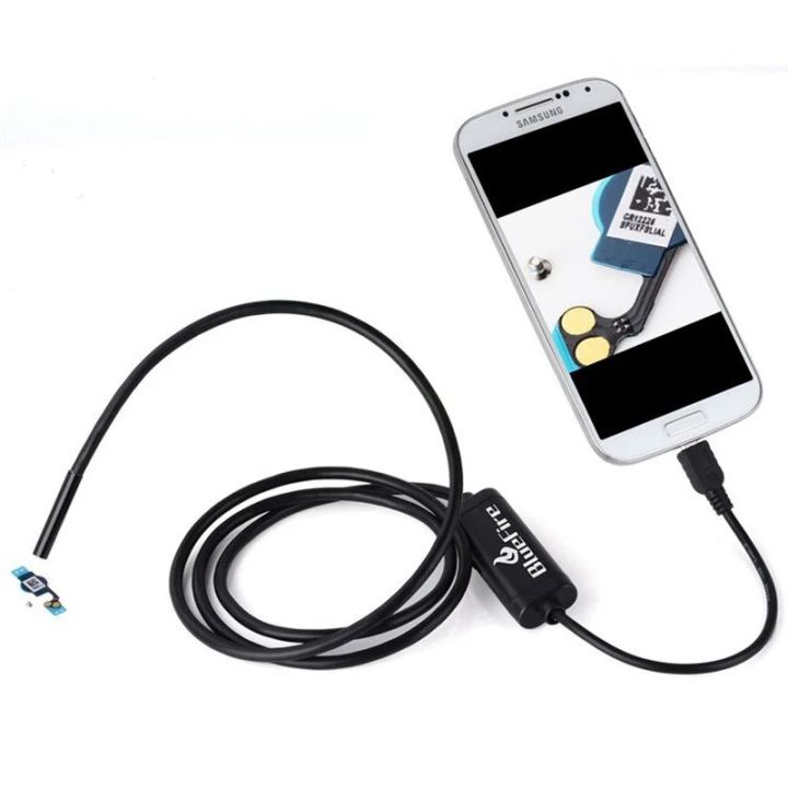 USB borescope camera plugged into a smartphone showing live inspection view of electronic components