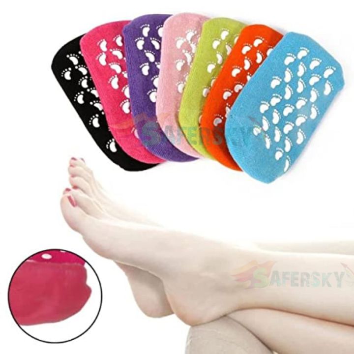 Silicone gel spa socks in multiple colors — black, red, purple, pink, green, orange and blue with white footprint gel dots, moisturizing gel lining close-up