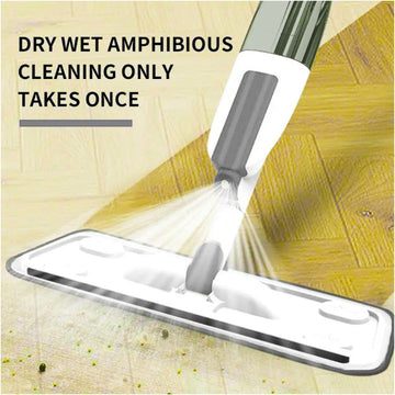 Spray mop with refillable bottle spraying fine mist on the floor