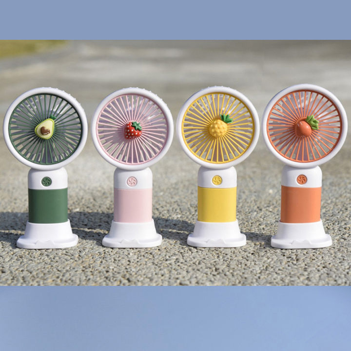 Mini desk fans in four colors on desk stands