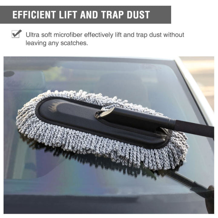 Grey microfiber car duster lifting and trapping dust on a windshield — soft fibers leave no scratches