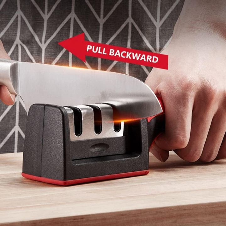 4-in-1 knife sharpener in use on a wooden countertop — pull the knife backward through the slot