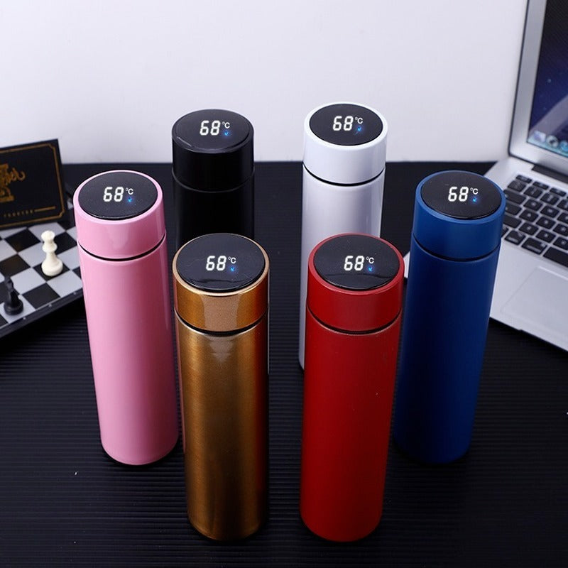Smart thermos flask in hand, LED display visible