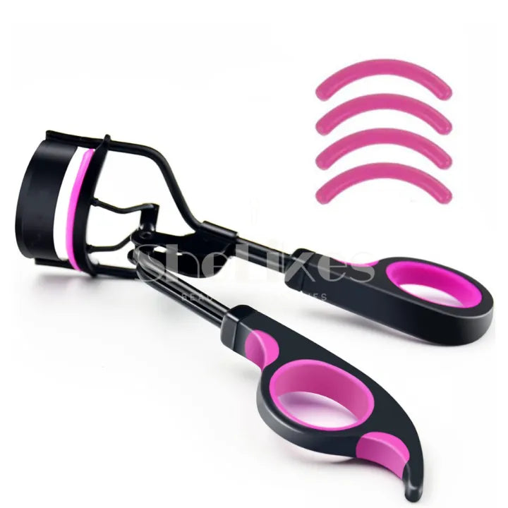 Eyelash curler side view — lever-clamp mechanism with four pink silicone replacement pads shown separately