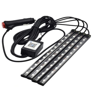 Car interior LED strip lights glowing RGB colours in footwell at night