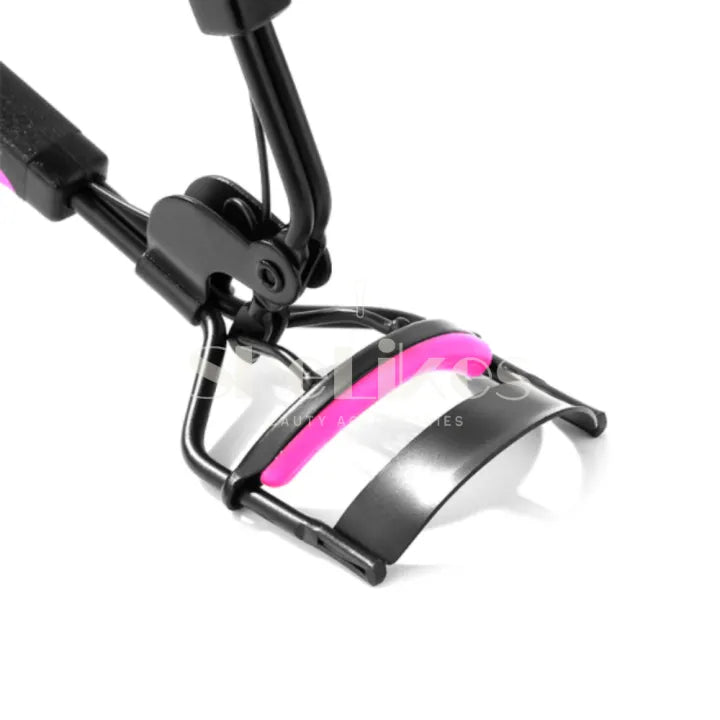 Eyelash curler close-up — pink silicone curling pad and clamp head detail of the mechanical curler